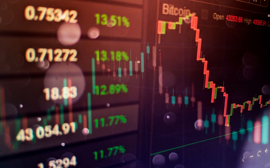 Tela de computador com gráficos de investimentos para ter uma renda mensal